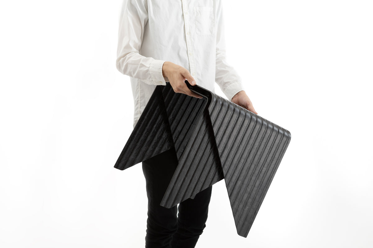 Black colored layer made out of TAFNEX CF-PP Design sheets using thermoforming process. 